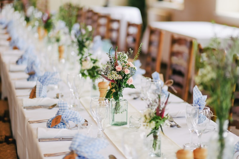 A long event table dressed with flowers